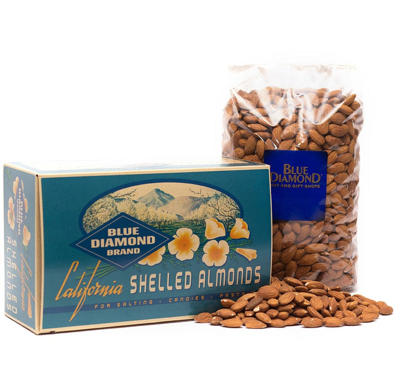 closed gift box with large bag of almonds next to it